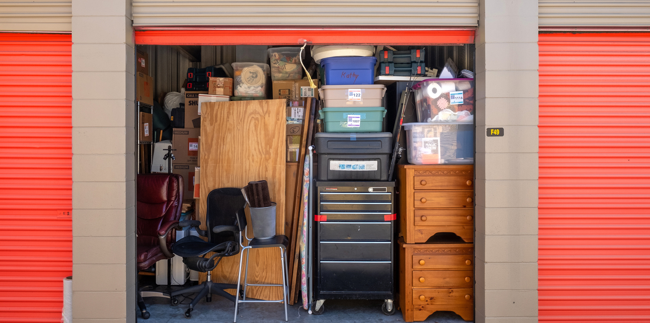 Open storage unit with red doors
