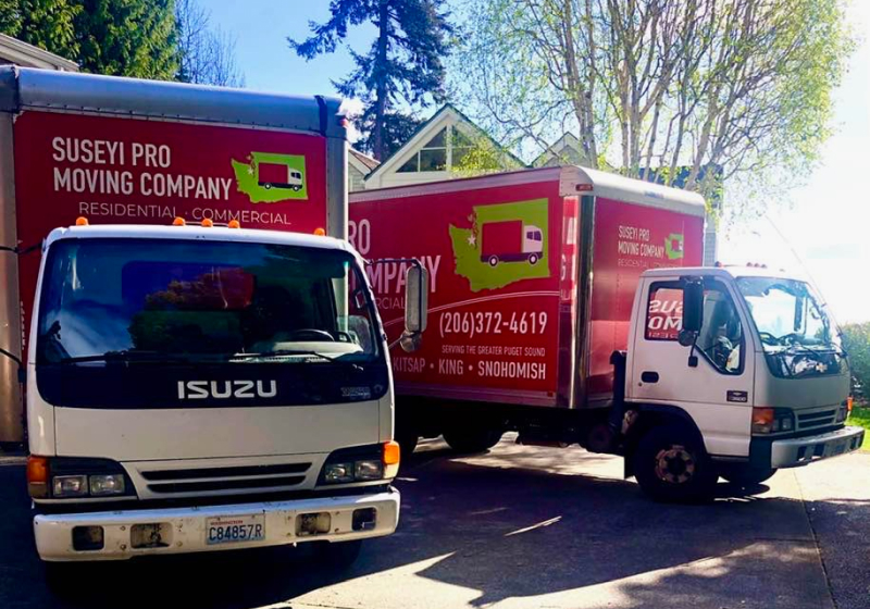 Two Suseyi Pro Moving Company Trucks