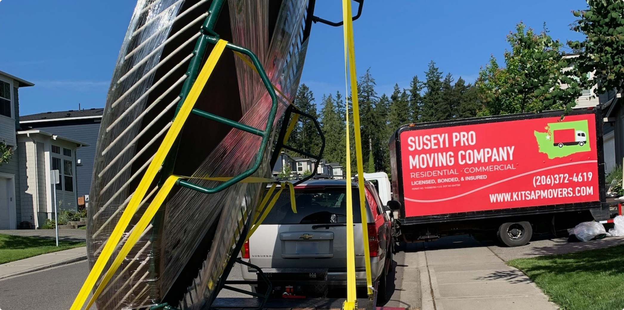 Heavy item on a Suseyi Pro Moving Company trailer